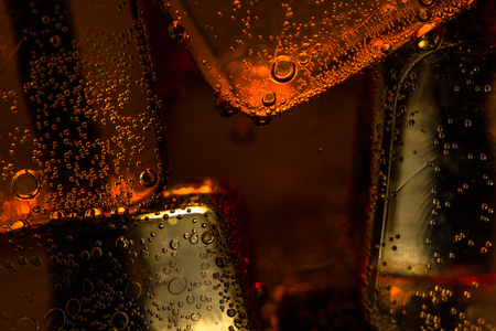 Close up view of the ice cubes in cola backgroundの写真素材