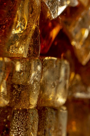 Close up view of the ice cubes in cola backgroundの写真素材