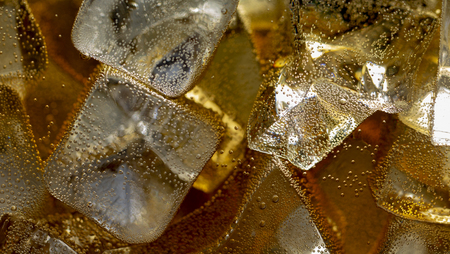 Close up view of the ice cubes in cola backgroundの写真素材