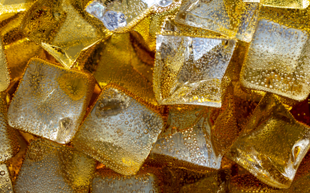 Close up view of the ice cubes in cola backgroundの写真素材