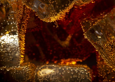 Close up view of the ice cubes in cola backgroundの写真素材