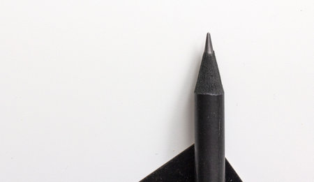black pencil on a white background