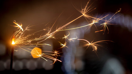 Flames of Bengal fire on the streets of the night city in defocus background