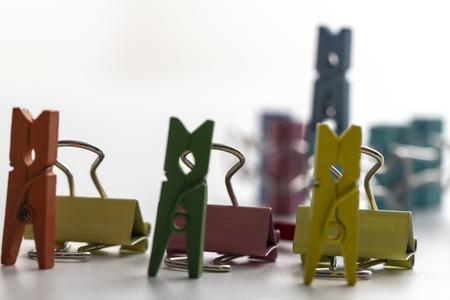top view of colorful paper clip, black paper clip. Desk office concept, copy space, isolated on white backgroundの写真素材
