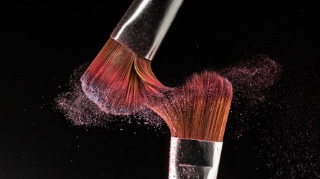 powder splash and brush for makeup artist or beauty blogger in black backgroundの写真素材