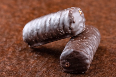 Chocolate bars on brown paper background close-upの写真素材