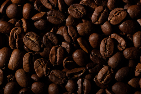 Coffee beans on the table background blurred abstract background blurred abstract backgroundの写真素材