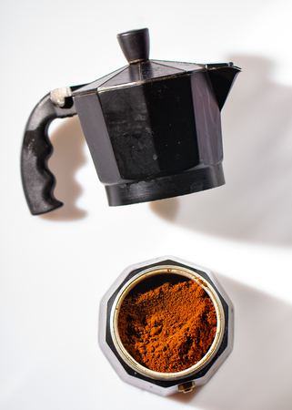 black geyser coffee maker with ground natural coffee inside on a white background top wievの写真素材