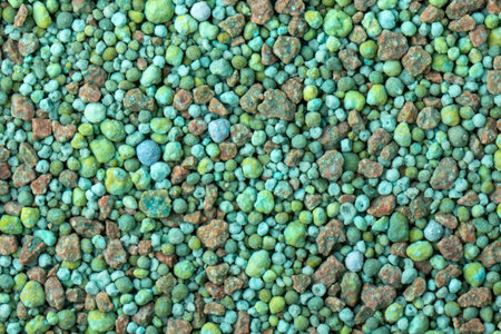 green mineral for coniferous plants, with microelements fertilizer texture background.