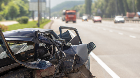 car has dented rear bumper damaged after accident close upの写真素材