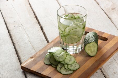 Cucumber water, cleansing water to detoxify the body and quench thirst on a white background. close-upの写真素材