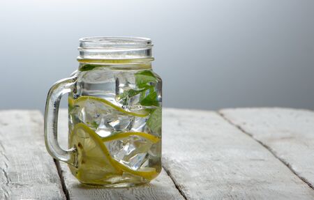 Cucumber water, cleansing water to detoxify the body and quench thirst on a white background. close-upの写真素材