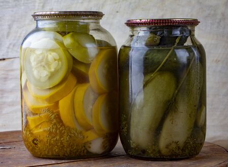 Pickled cucumbers in a glass jar close upの写真素材