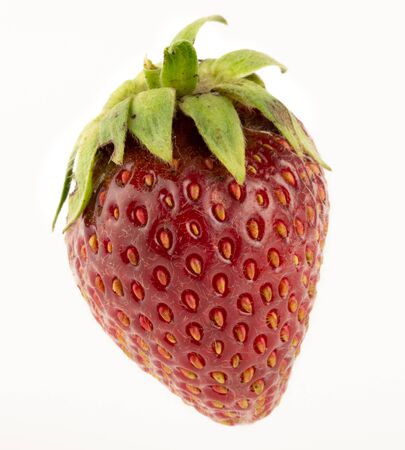 Beautiful ripe natural non-ideal shaped strawberries on a white background close upの写真素材