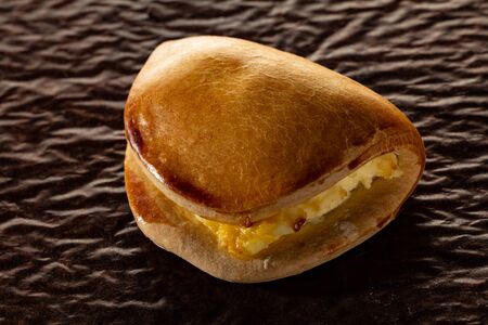 A cheesecake, an armchair on a brown old paper, a close-up.の写真素材