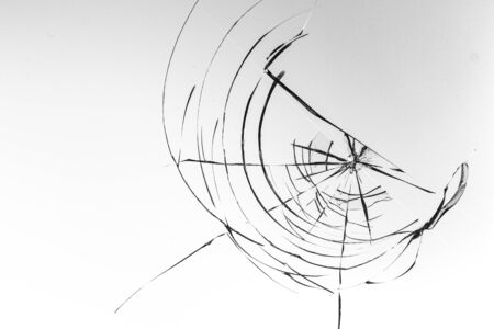 Cracked glass on a white background close upの写真素材