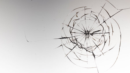 Cracked glass on a white background close up