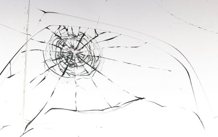 Cracked glass on a white background close up