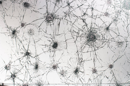 Cracked glass on a white background close up
