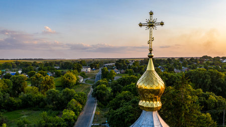 Old wooden church with metal roof. Located in a small village drone viewの写真素材