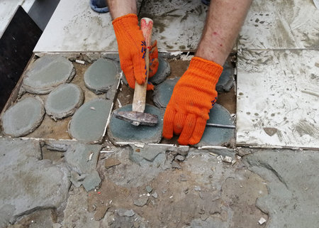 Poorly laid tile. Consequences of work of unscrupulous builders Close up