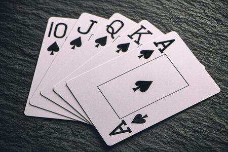 Royal Flush on a black background, a very rare poker hand close upの写真素材