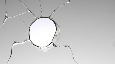 Cracks in a bullet punched glass, for use in design and special effects.の写真素材