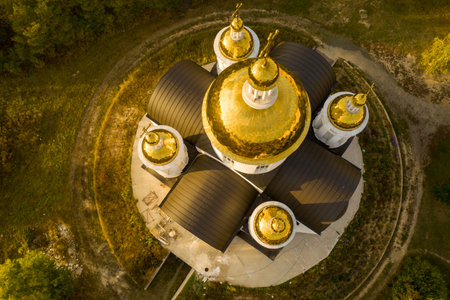 Five golden domes of the church with crosses on the top. drone shooting, top view.