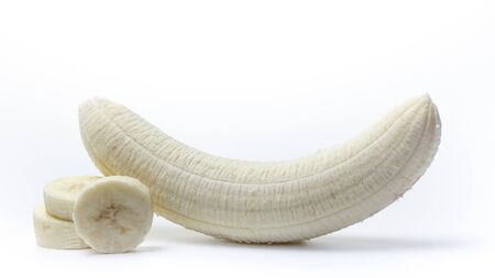 Peeled and sliced banana on a white backgroundの写真素材