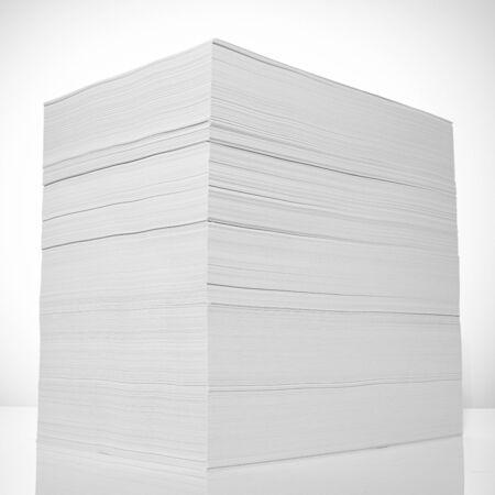 Stack of office paper, on a white background. Concept, minimalismの写真素材