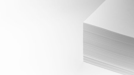 Several stacks of white paper on a white background