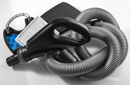Set of vacuum cleaner accessories on a white backgroundの写真素材