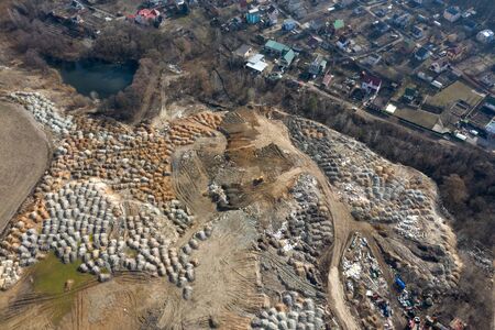 Construction site near the village and the forest, the impact of human economic activity on the environment and the landscape.の写真素材