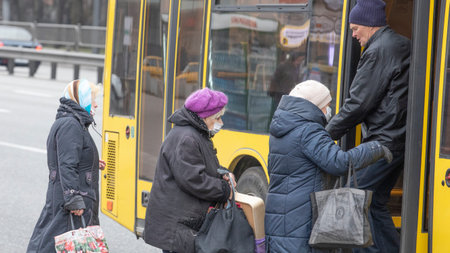 Ukraine Kiev March 23: Quarantine measures against the spread of SARS-CoV-2 or COVID-19 coronaviruses. When using public transport, people are required to use medical masks to prevent the spread of the infection.のeditorial素材