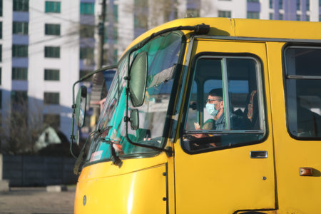 Ukraine Kiev March 23: Bus driver in medical mask. Quarantine measures against the spread of...