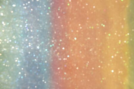 Abstract light sunny bokeh on orange paper background.の写真素材