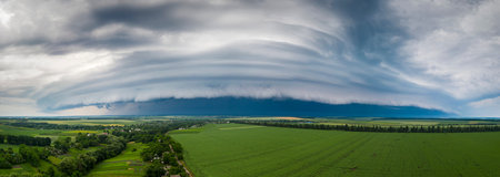 Thunderstorm and storm clouds on the horizon in the countryside.