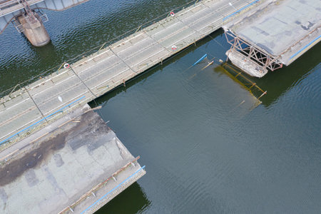 Damaged road bridge across Fallen bridge in the city of Pokrov, Ukraine. Part of the road collapsed...