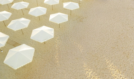 Empty beach with many umbrellas and a place to relax. Unsuccessful tourist season due to the...