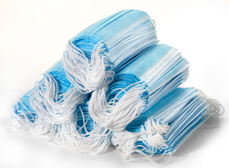 Many medical disposable blue mask, two stacks on a white background mask for protection against...