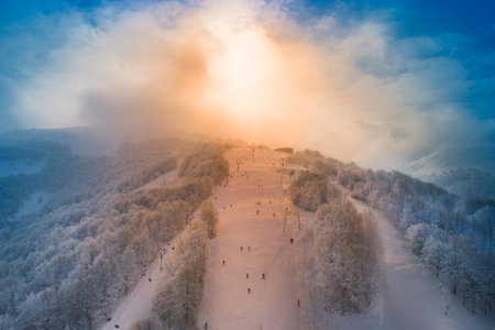 Dolomites. View of the ski slope and the lift at dawn. Wonderful winter mountain morning landscape.
