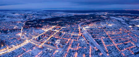 Winter cityscape. Illuminated streets of the suburbs, and cottages.の写真素材