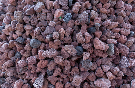 Granules of frozen red lava for landscaping or decor