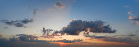 Dramatic stormy sky. Morning rain clouds and sunbeams. Natural background.