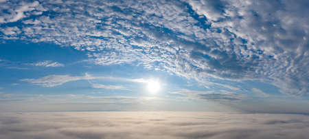 Wonderful dawn over the clouds. white clouds and blue sky.の写真素材