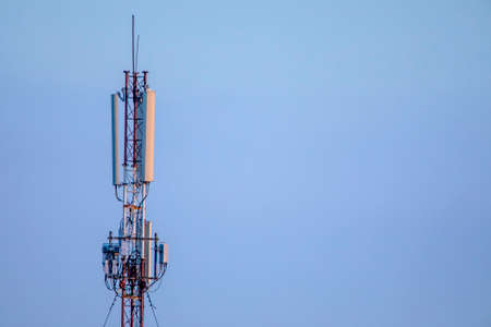 Telecommunication 5g tower on a background of blue sky.の写真素材