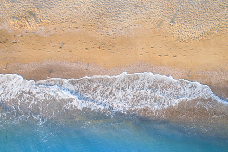 Empty tropical wild beach, light sand and blue clear water. Aerial view.の写真素材
