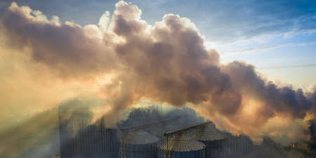 Harmful emissions from heavy industry are causing global warming and climate change.の写真素材