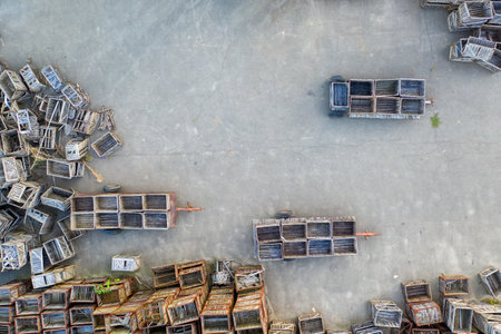 Lots of wooden boxes on the asphalt site. Aerial view.の写真素材