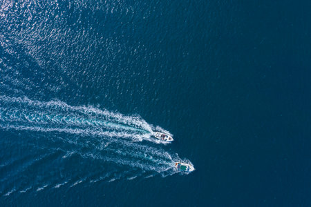 Holidays at sea. Two high-speed yachts, drone view. Walks on the sea, rent of sea vessels.の写真素材